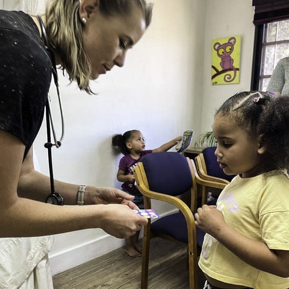 Dr. Rockhill engaging with children in the community
